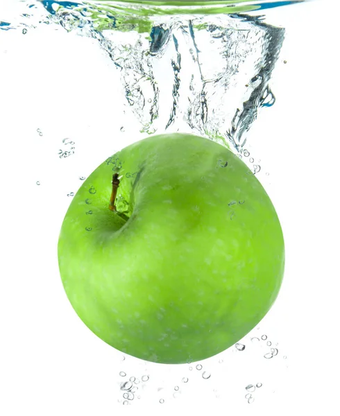 Fresh apple falling in water — Stock Photo, Image