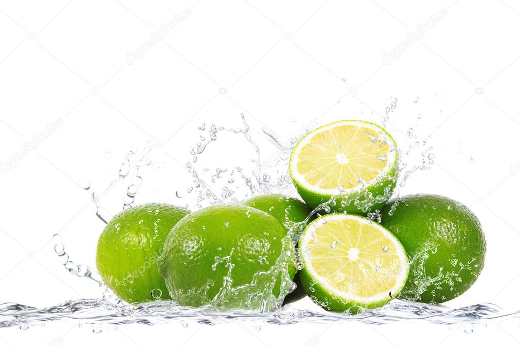 fresh lime falling in water
