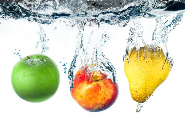 Fruits falling in water — Stock Photo, Image