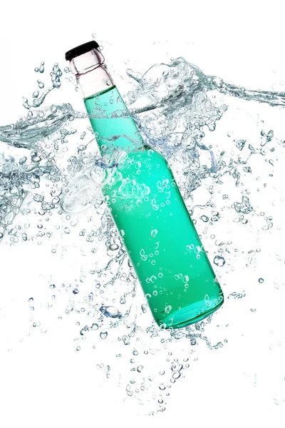 Glass bottle falling in water — Stock Photo, Image