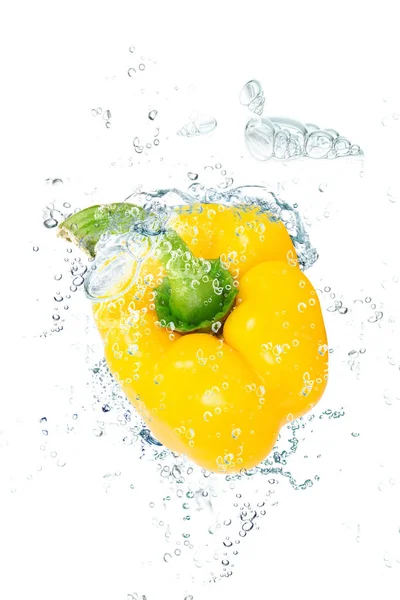 Fresh peppers falling in water — Stock Photo, Image