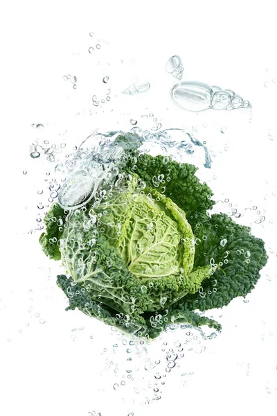 Savoy cabbage falling in water — Stok Foto