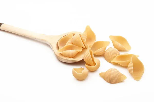 Wood spoon with italian pasta on white background — Stock Photo, Image