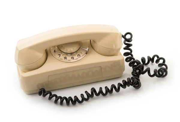 Устаревший телефон на белом фоне — стоковое фото