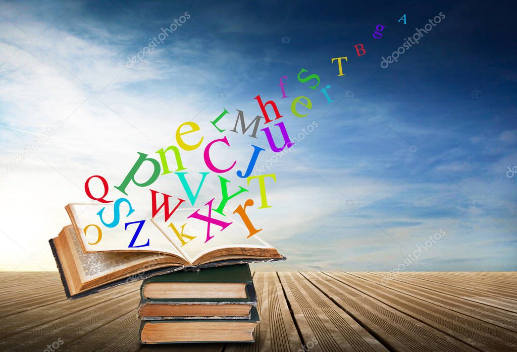 alphabet with books in sky background