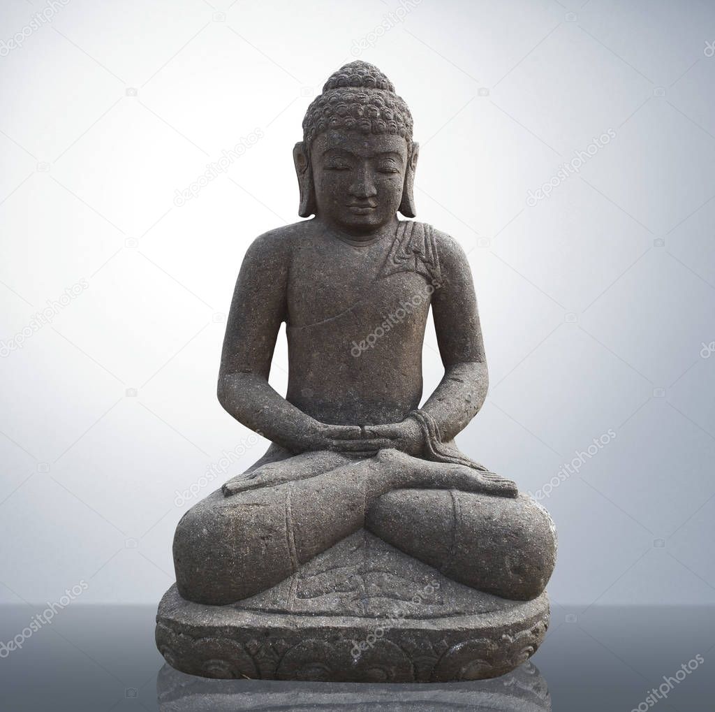 Statue of Buddha in gray background