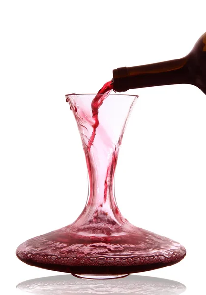 Red wine poured into decanter — Stock Photo, Image