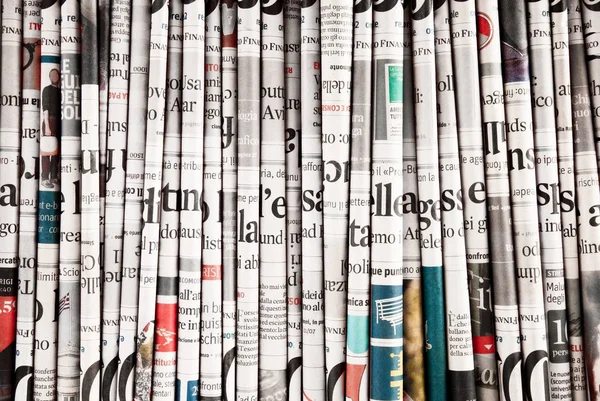 Newspapers folded to form a background — Stock Photo, Image