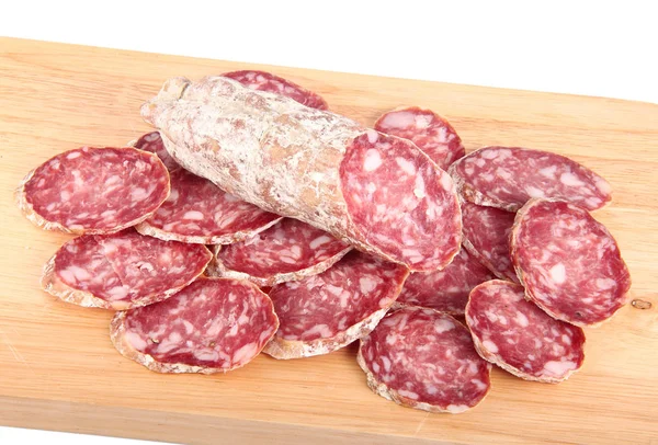 Rodajas de salami italiano sobre tabla de madera —  Fotos de Stock