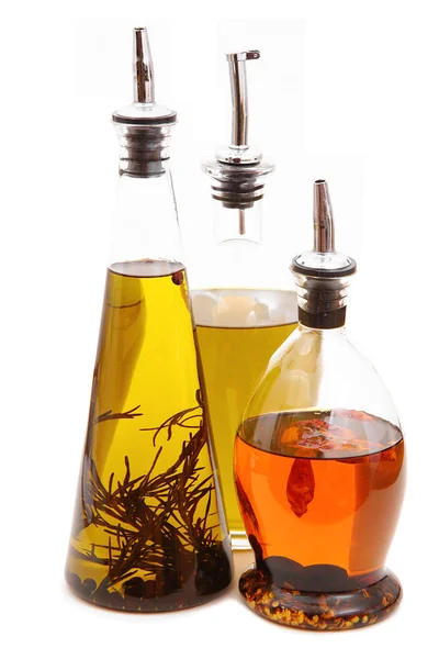 Bottles of oil in white background — Stock Photo, Image