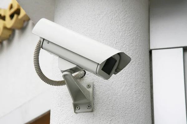 Control camera in wall background — Stock Photo, Image