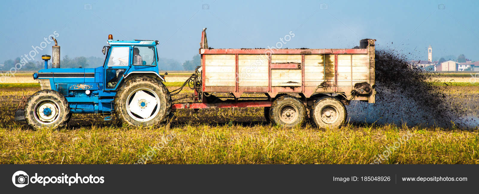 Tractor work in agricultural field Stock Photo by ©Photobeps 185048926