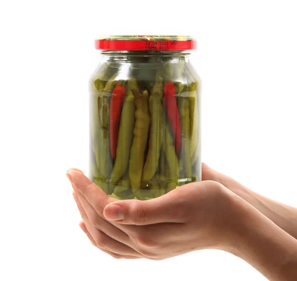 Jar of pepper hand held in white background — Stock Photo, Image