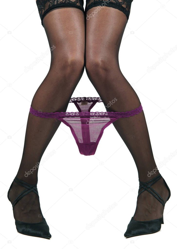 legs of girl in provocative attitude in white background