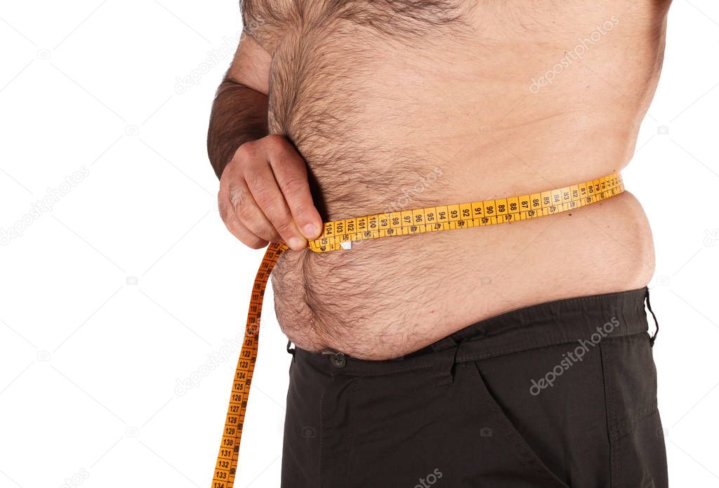 Overweight man measuring belly 