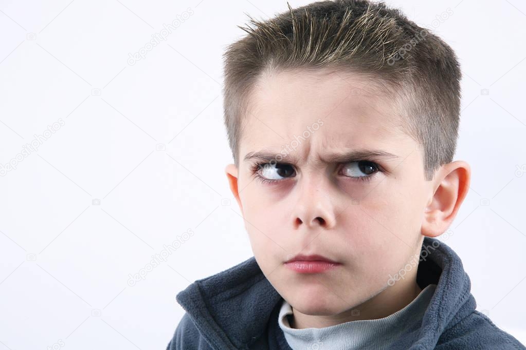 angry young boy in white background