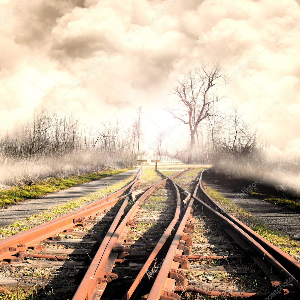 railway in foggy landscape