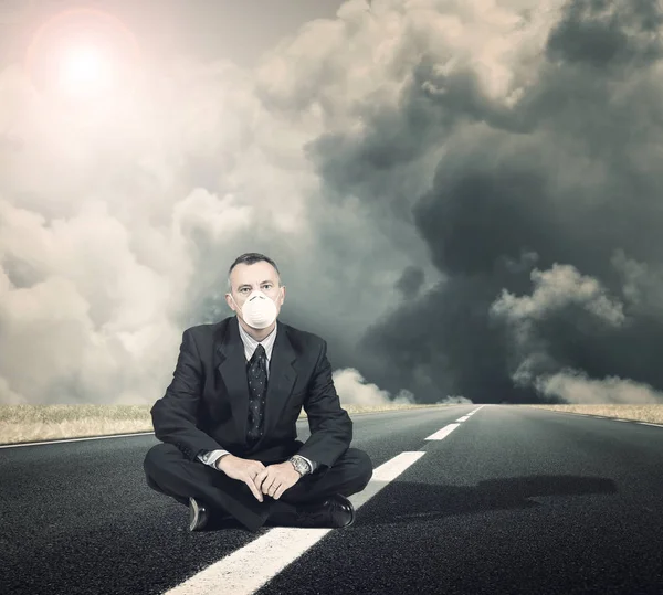 Man sitting in a middle of the road — Stock Photo, Image