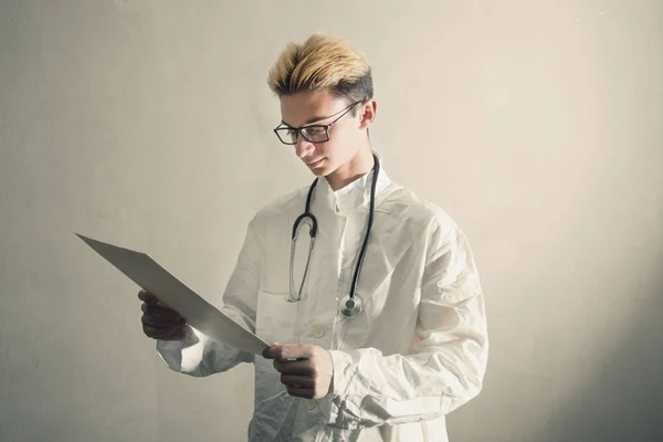 Young Doctor consult a medical briefcase