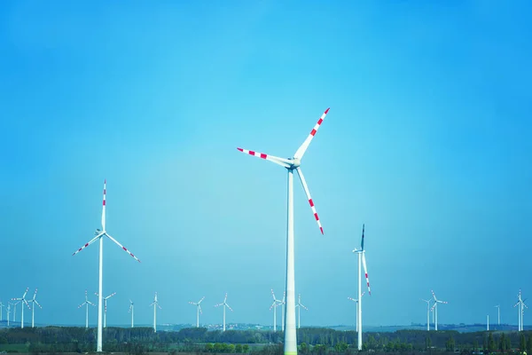 Wind turbine .Sustainable development, renewable energy.Windmills for electric power production,white wind turbine generating electricity on blue sky.