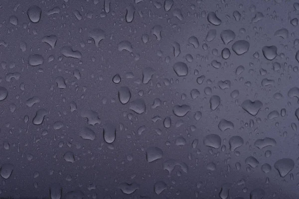 Water droplets on black background.Fresh raw chicken fillet on a wooden cutting board.