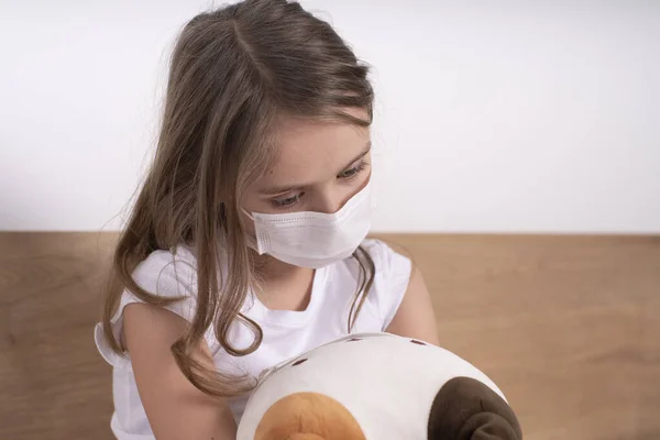 Little Sad Girl Protective Mask Plays Toy Concept Fight Coronovirus — Stock Photo, Image