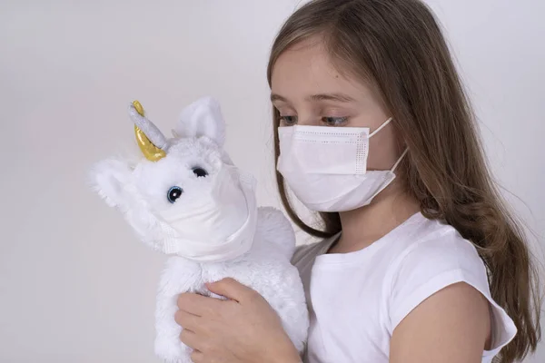 Little Sad Girl Protective Mask Plays Toy Concept Fight Coronovirus — Stock Photo, Image