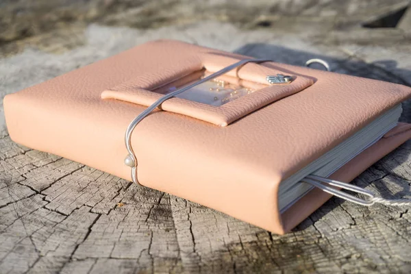 Handmade pink leather notebook with decoration like shaker with