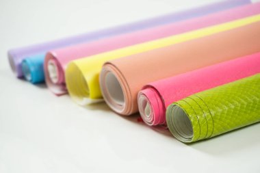 Different colors of leather rolls for artwork and craft clipart