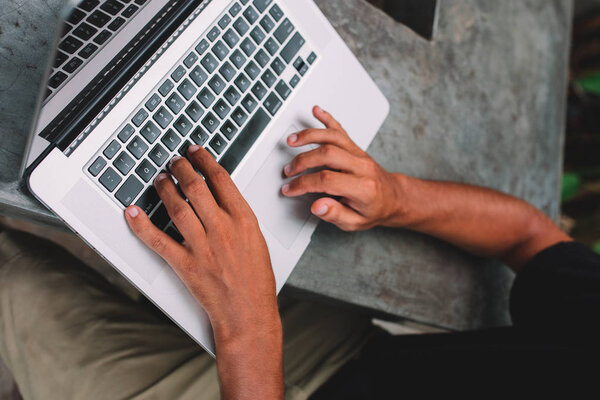 male hands on laptop keyboard