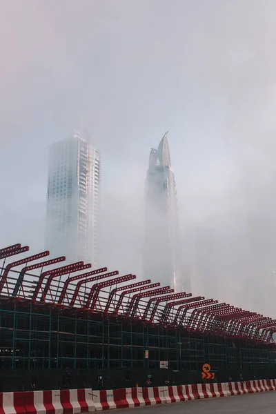 Skyscrapers through fog in Dubai — Stock Photo, Image