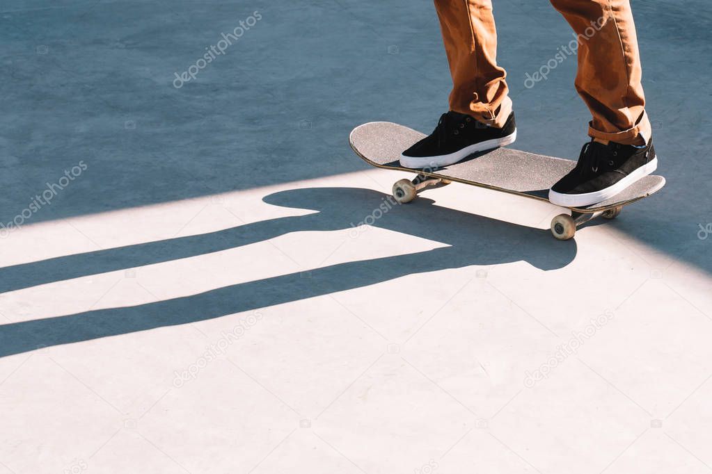 skater's legs and skateboard
