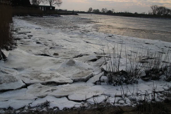 Ice flakes on river Hollandse IJssel at nieuwerkerk aan den IJssel during winter in the Netherlands