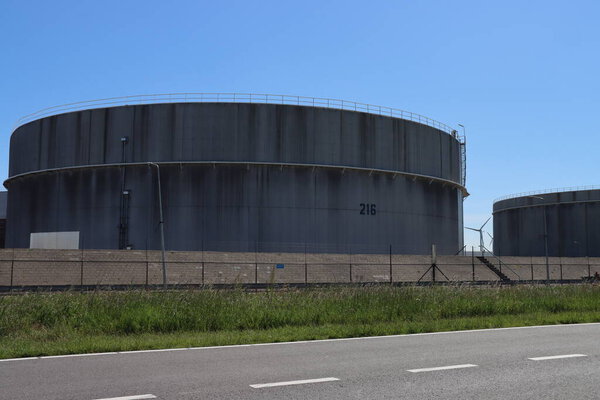 Storage tanks for crude oil or refined products like petrol or diesel at the refinery of Exxon Mobile in the botlek Harbor in the port of Rotterdam Netherlands
