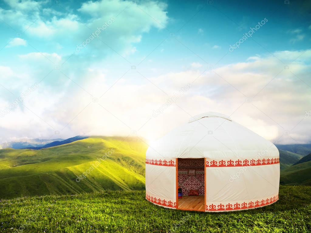 Beautiful mountain landscape with the white Yurt, Kazakhstan