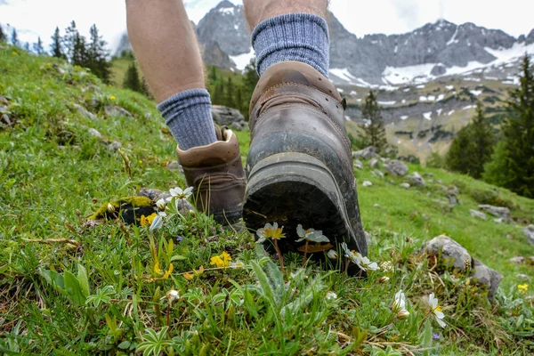 Hiking in the mountains with hiking boots