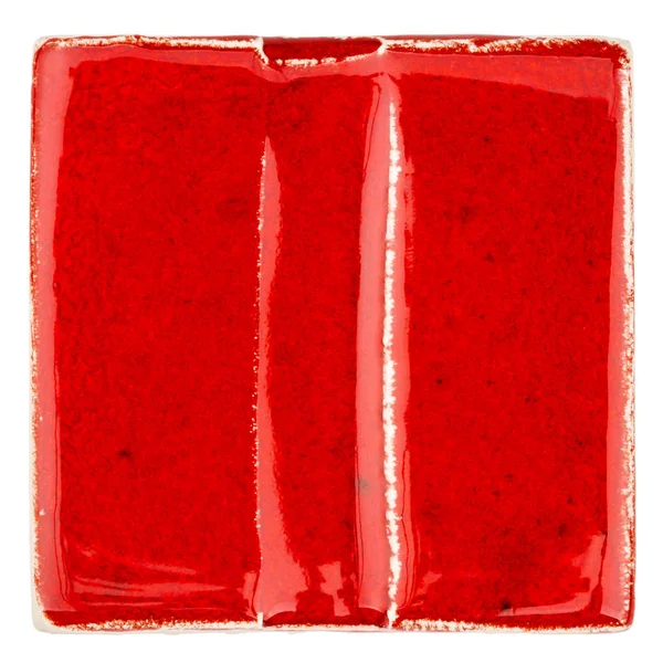 Handmade glazed red ceramic tile — Stock Photo, Image