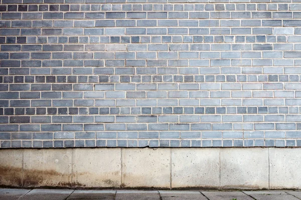 Muro di mattoni grigio — Foto Stock