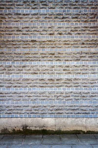 Muro di mattoni grigio — Foto Stock