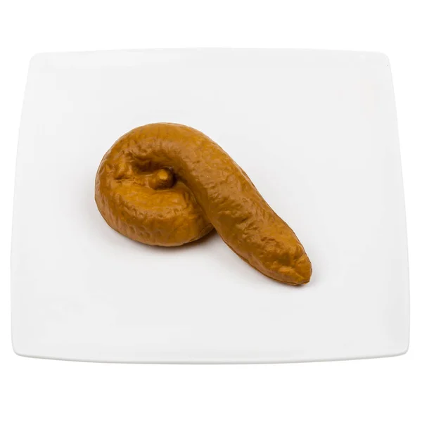 Fake excrement in a plate — Stock Photo, Image