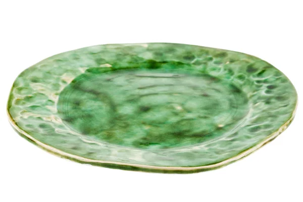Зелена гончарна тарілка ручної роботи — стокове фото