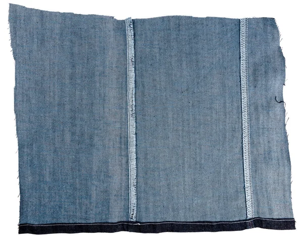 Кусок ткани из синих джинсов — стоковое фото