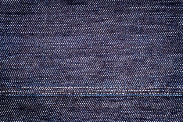 Textura de jeans azul escuro — Fotografia de Stock