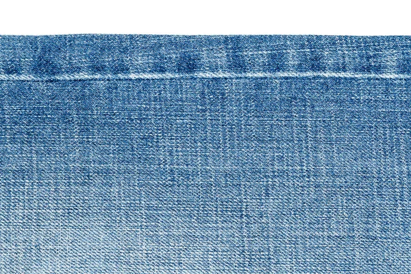 Stuk van licht blue jeans stof — Stockfoto