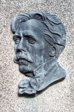 Bas-relief of famous Lithuanian composer and painter M. K. Ciurlionis on his grave clipart