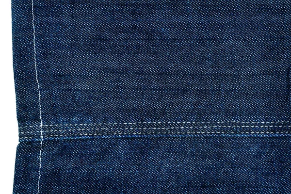 Stuk van donkerblauwe jeans stof — Stockfoto