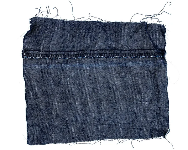 Kus látky modré džíny — Stock fotografie
