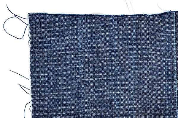 Stuk van donkerblauwe jeans stof — Stockfoto