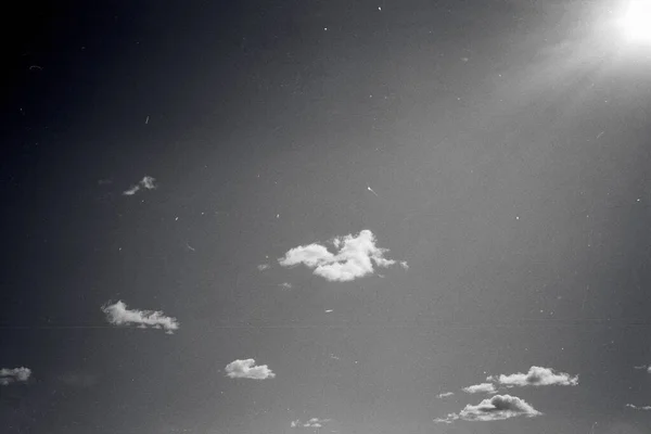 Grunge image of sky with some clouds on grainy film texture — Stock Photo, Image
