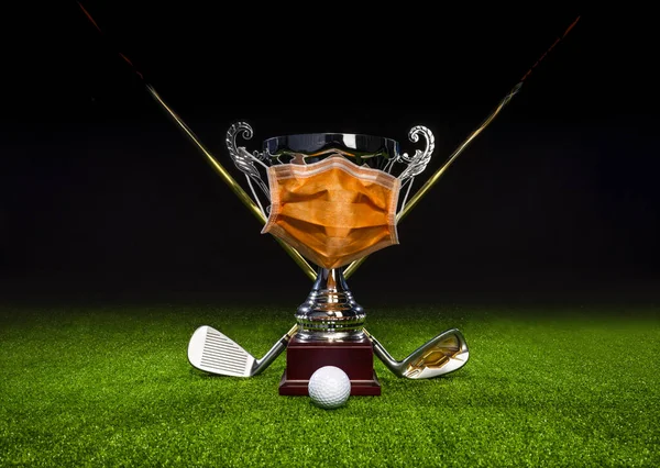 Golf club, golf ball and golf trophy with protective mask, horizontal composition. SAVE GOLF